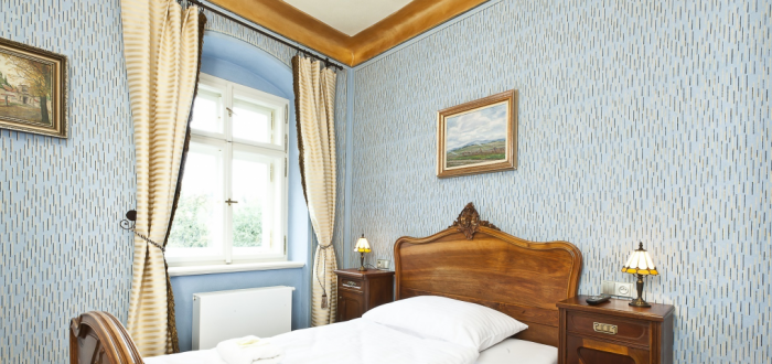 Luxusní pokoje v hotelu Latrán, z kterých je cítit historie města